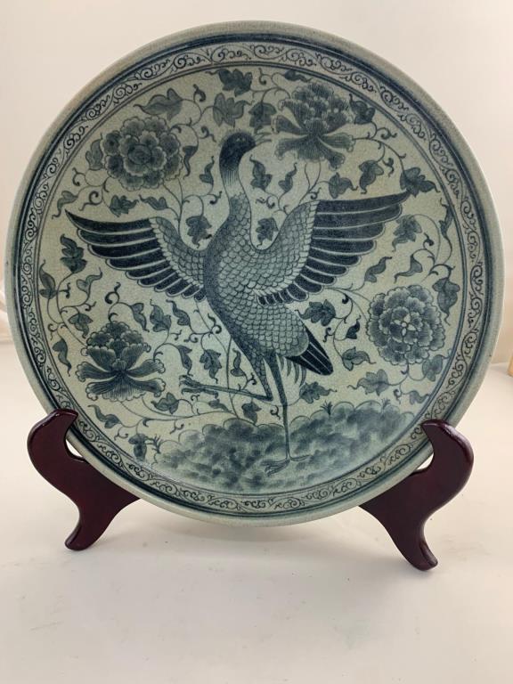 ANTIQUE VIETNAMESE CELADON CHARGER: Beautifully painted under-the-glaze of a flying bird in the center amongst blossoming peonies. Diameter: 12 1/2 in.
