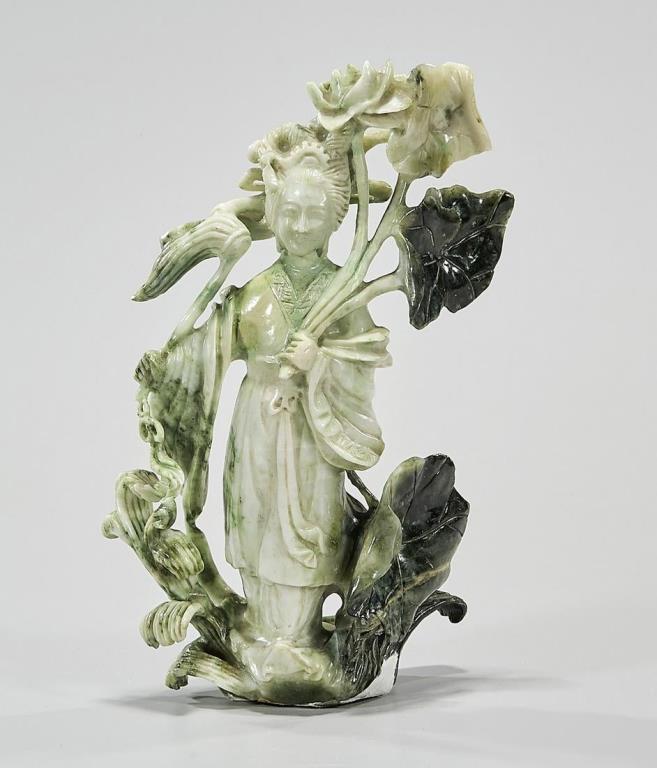 CHINESE CARVED STONE FIGURE OF HE XIANGU: Dressing in a flowing gown and holding lotus flower. H: 8 in.
