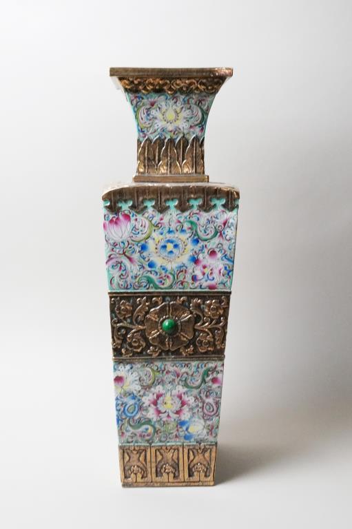 CHINESE ENAMELED PORCELAIN SQUARE VASE: With metal design. Beautifully painted with blossoming flowers and scrolling leaves. Also inlaid with precious stones. Six-character mark in relief on the bottom to read Yongzheng. H: 20 in.