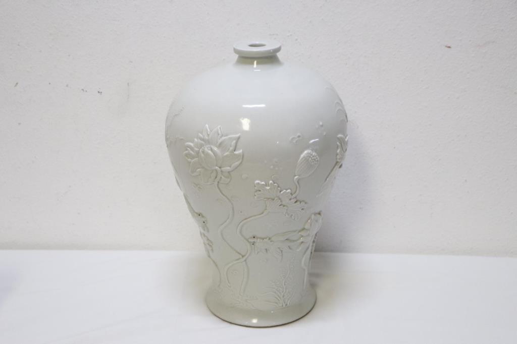 LARGE 19TH C. CHINESE BLANC DE CHINE MEIPING VASE: Beautifully hand-carved in relief all over the body with water lilies and fishes. A carved four-character mark to the bottom. H: 13 in. (33 cm) W: 8 in.