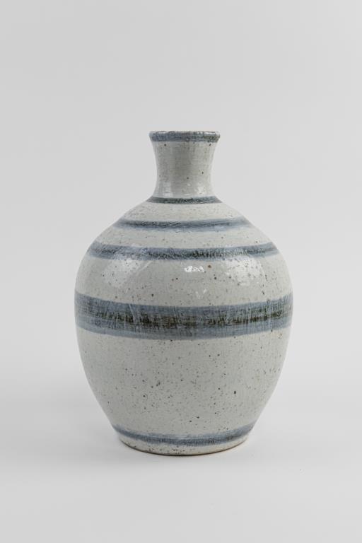 KOREAN BLUE AND WHITE VASE: With a bulbous body, flanked by a long neck and slightly flared mouth. H: 12 in. (31 cm)