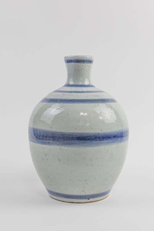 KOREAN BLUE AND WHITE VASE: With a bulbous body, and flanked by a narrow neck.