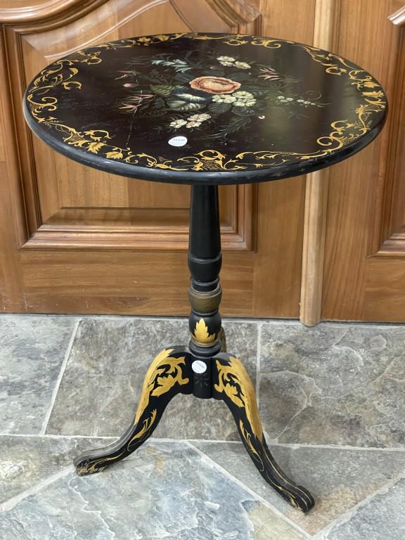 19TH CENTURY ENGLISH HAND-PAINTED EBONIZED SIDE TABLE: Raised by three elegant legs, with baluster shaped central support. The striking top is beautifully painted with blossoming flowers with vivid colors and gilt details. H: 27 in. W: 21 1/2 in. Property