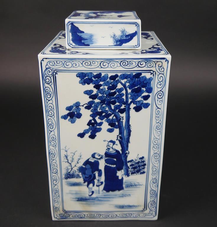 ANTIQUE BLUE AND WHITE SQUARE VASE WITH LID: Each side of the rectangular panel is hand-painted with a figural scene. H: 13 3/4 in.