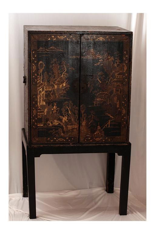 ANTIQUE CHINESE EXPORT LACQUER CHEST ON STAND: H:44 1/2" X L:28 3/4" W:20" late 18th/early 19th century, with gilding and some losses to the lacquer, base of chest is a later addition (not an antique), cabinet has sectional drawers painted with va