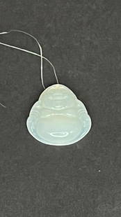 A JADE BUDDHA PENDANT: Carved as a Happy Buddha.