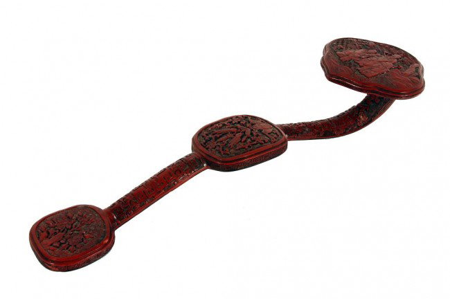 ANTIQUE CHINESE CARVED CINNABAR LACQUER SCEPTER: L: 19 1/2 in. (49cm), elaborately carved scepter; the headpiece decorated with three sages, one holding a scepter, one carrying a child, the last holding a staff and handing a peach to another boy, th