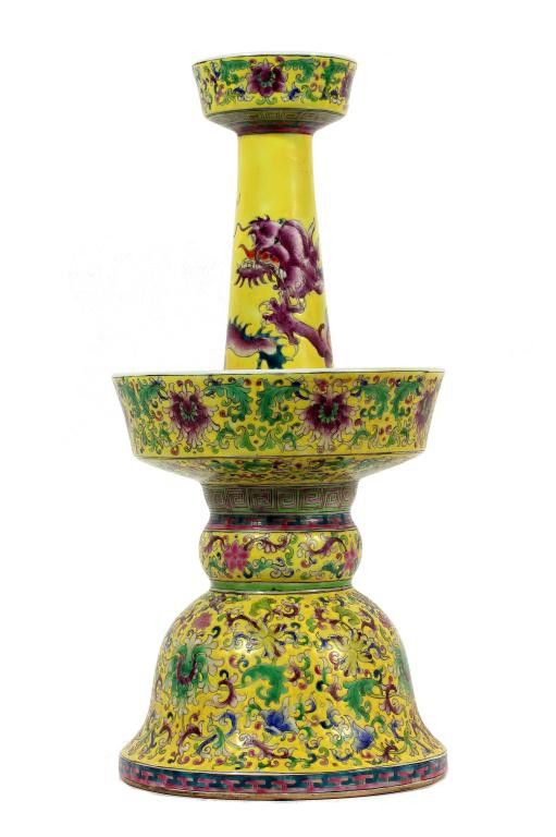 CHINESE FAMILLE JAUNE PORCELAIN CANDLESTICK HOLDER: H: 14 1/4 in. (36cm), formed in two sections, the hollow lower half of bell with lobed knops and slightly flared stem, and the upper half formed as a tapering neck with bowl-shaped mouth rising from a