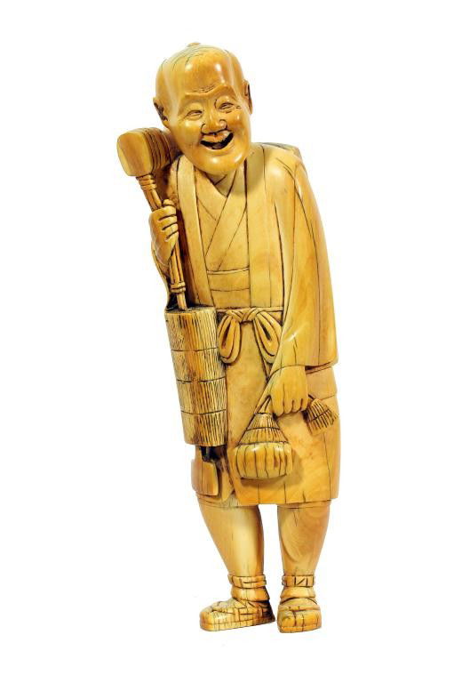 JAPANESE IVORY FIGURE OF A HAPPY OLD MAN: H: 9 3/4 in. (25cm), wearing a belted robe and holding a basket by his shoulder, and a pouch