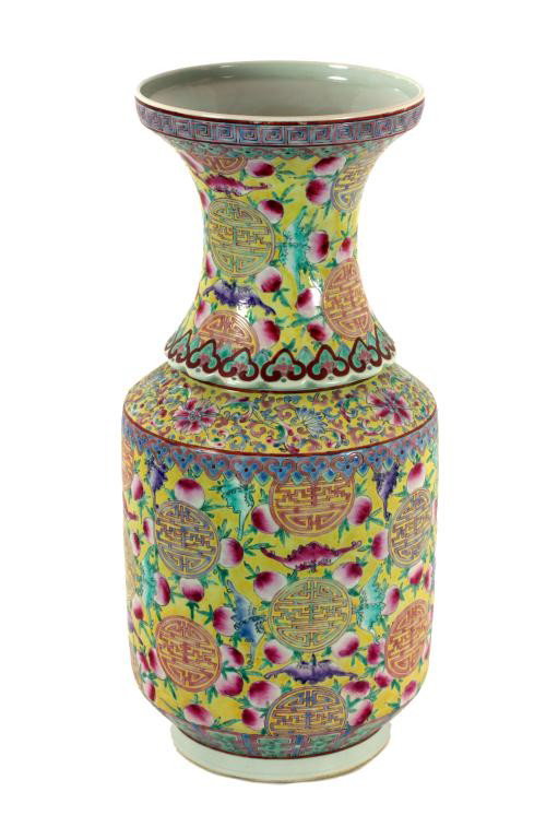 CHINESE FAMILLE JAUNE ROULEAU VASE: H: 18 in. (45cm), comprising of two sections, both raised and enameled with asymmetrical design of bats and peaches alternating to surround key fret shou marks in round panels, the body between border