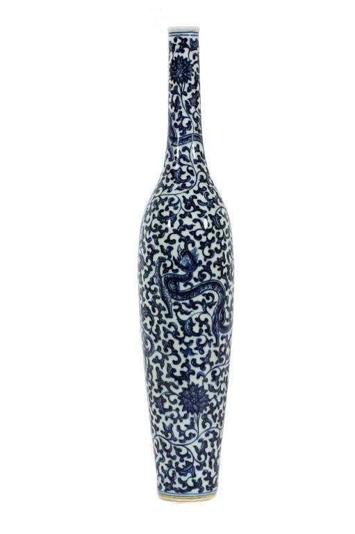 CHINESE BLUE AND WHITE SLENDER PORCELAIN VASE: H: 15 1/3 in. (38cm), with interspersed flowers and tendrils, and three dragons round the body, between double ring borders, Qianlong seal mark on the base