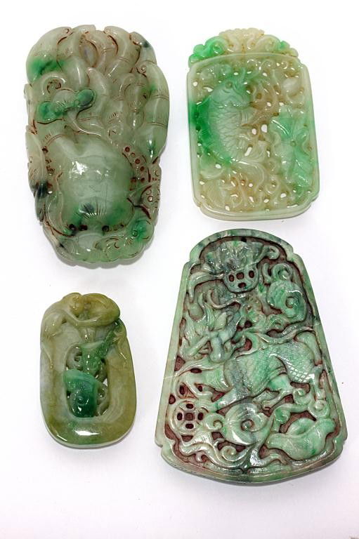 LARGE CHINESE FOLIATE BLUE POTTERY DISH: D: 23 in. (58cm), hand-painted under heavy glaze with auspicious emblems at the center within stylized petals radiating meandering large flowers and tendrils, within a border of a dragon hair flurries