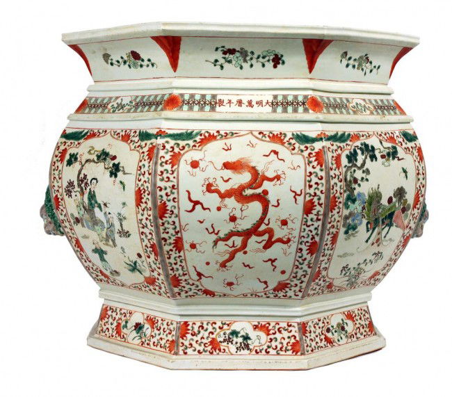 SMALL CHINESE SPINACH JADEITE GUANYIN SHRINE: H: 5 in. (13cm), finely carved, in flowing robes holding a bottle of "tears".