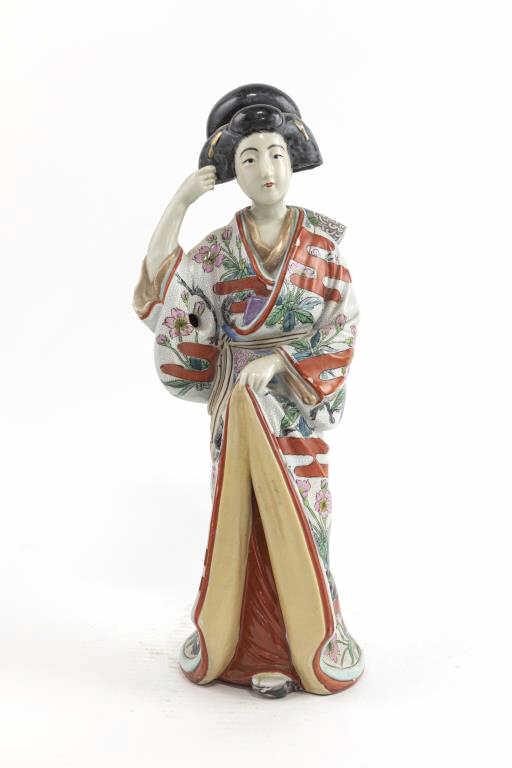 JAPANESE MEIJI PERIOD ENAMELED FIGURE OF GEISHA: Dressing in a beautiful kimono, painted with enamel of blossoming flowers.H: 15 7/8 in. W: 6 in.
