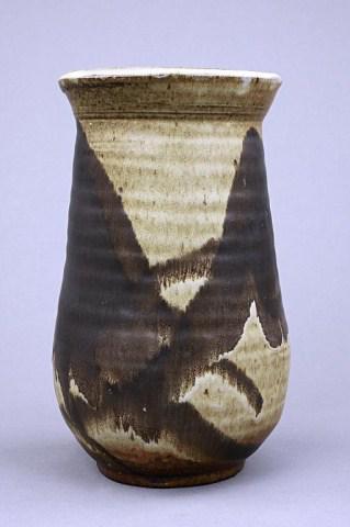 STUDIO POTTERY VASE: With flared mouth rim, body is decorated with abstract brown glaze design. Mark on bottom. H: 9 1/2 in.