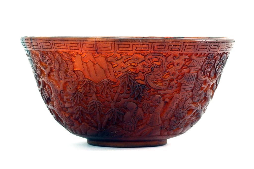 FINE ANTIQUE CHINESE RICE BOWL (CARVED HORN): Diameter: 4 1/2 in. (11.5cm), H: 2 1/4 in. (5.7cm), with superb continuous carving on the exterior of a rural village depicting of folks in daily activities amid bats and trees.