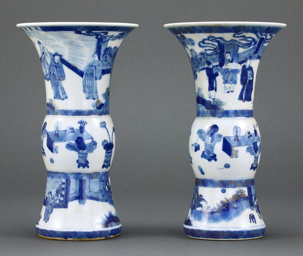 PAIR OF CHINESE BLUE AND WHITE BEAKER VASES: H: 7 in. (17.8cm) of cylindrical form with a flaring mouth and a short straight foot, brightly painted blue with gilt outline, the bulging middle section with 100 antiques design, set between scenes o