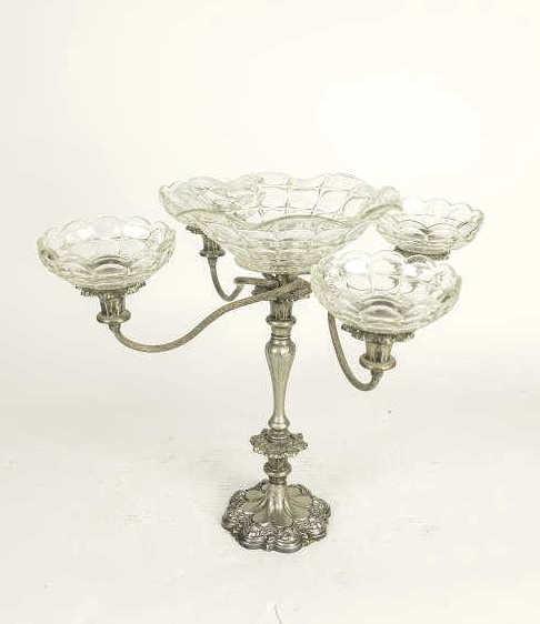 ENGLISH SILVER-PLATED CENTERPIECE: Each with shaped, floral shaped base with details. Flanked by a tall column with four swirling, up-swept arm in which each holds a smaller glass blow. Seated on top center with a larger, matching glas