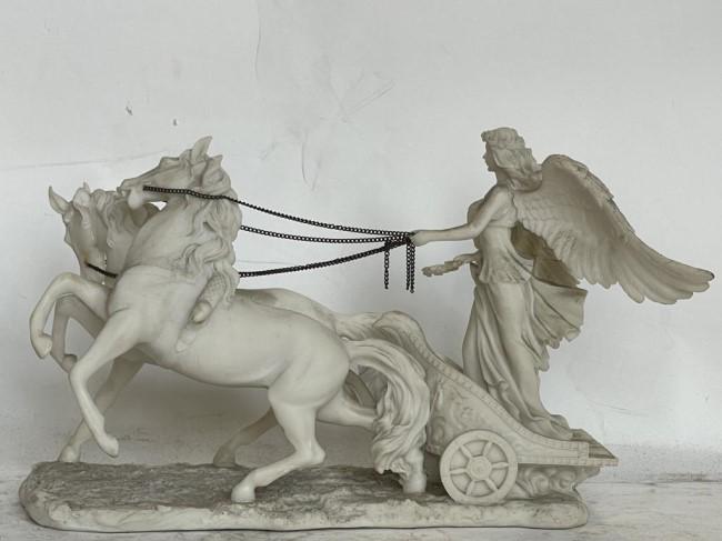 BISQUE FIGURE OF A GREEK GODDESS: Riding horse carriage, with plinth.H: 7 in. L: 9 1/2 in.