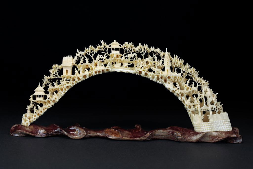 CARVED TUSK ON A STAND: H: 4 1/2 in.(11.5cm)