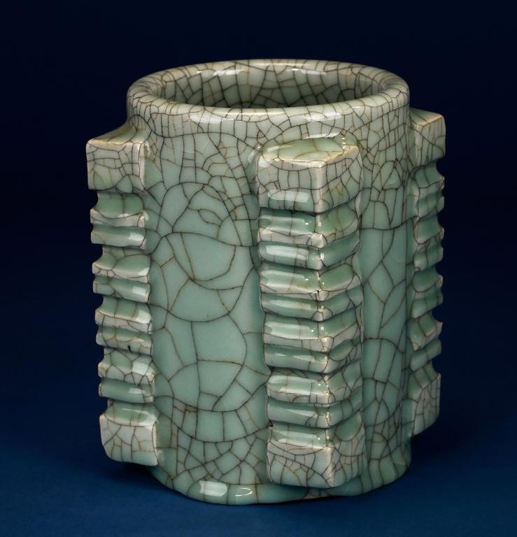 CHINESE ROUND CELADON CRACKLE BRUSH POT: Decorated on the four corners with six separate horizontal flanges. H: 7 3/4 in. (19cm)