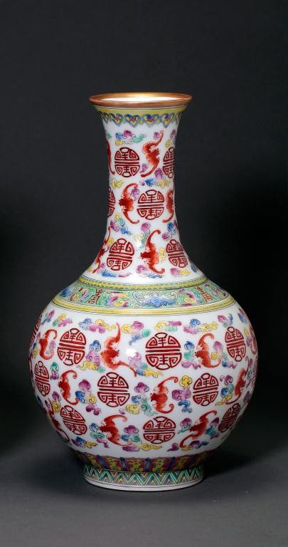 BEAUTIFUL CHINESE FAMILLE ROSE BOTTLE VASE: The globular body and slightly flared neck vibrantly painted with coral red bats, and double-bat emblems amidst clouds, below a band of shou marks around the shoulder. H: 9 1/2 in.(24cm)