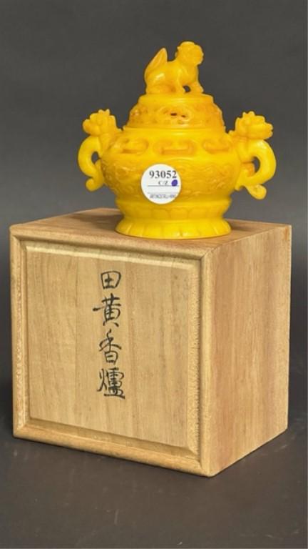 YELLOW CHINESE INCENSE BURNER: Of bulbous body with both handles of mythical creatures. Cover has finial with matching creature. Carved mark on the base. Comes with a wooden box. H: 5 in.