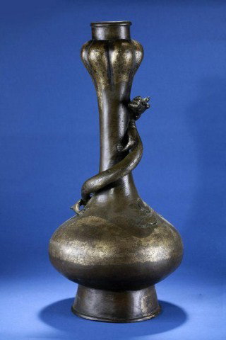 WANLI PERIOD BRONZE GARLIC HEAD VASE : Part of the Dr. I-San lin Collection, (1573 - 1619 AD) with a chi dragon circling the neck. The slender shape of the vase, the garlic bulb-like head, the high mouth rim and foot, and the shape of Chi 