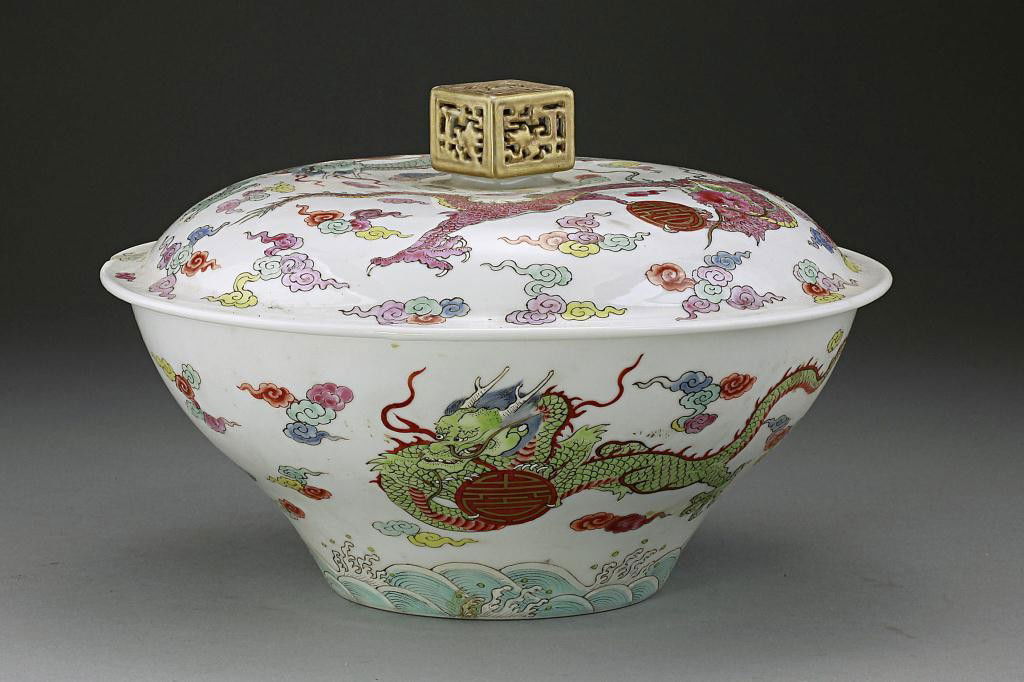 ANTIQUE CHINESE FAMILLE ROSE 'DRAGON' BOWL AND COVER: With an image of an imperial yellow, five-clawed dragon facing front and holding a shou medallion in the interior of the bowl amidst cloud scrolls. The cover with similar dragon motif is surmounted by
