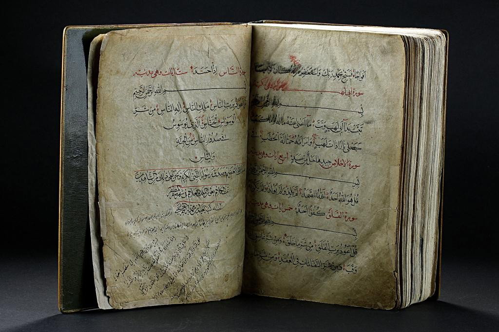 HAND WRITTEN KORAN DATED 1120: Also commonly called as Alcoran of Mohammed is the central religious and sacred text of Islam faith. This Koran simply yet extensively written in Arabic script. Evident fading of ink, and wearing of l