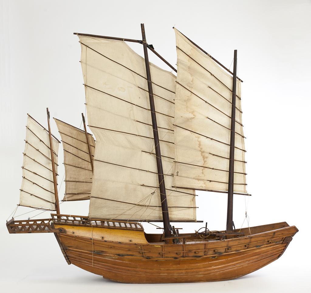ANTIQUE CHINESE CARVED WOODEN SHIP: Chinese wooden sailing ship with four sails. Four sails are set obliquely, so all can be fixed in the same direction. A separate wooden cannon and an iron anchor on the deck. The windows and doors on