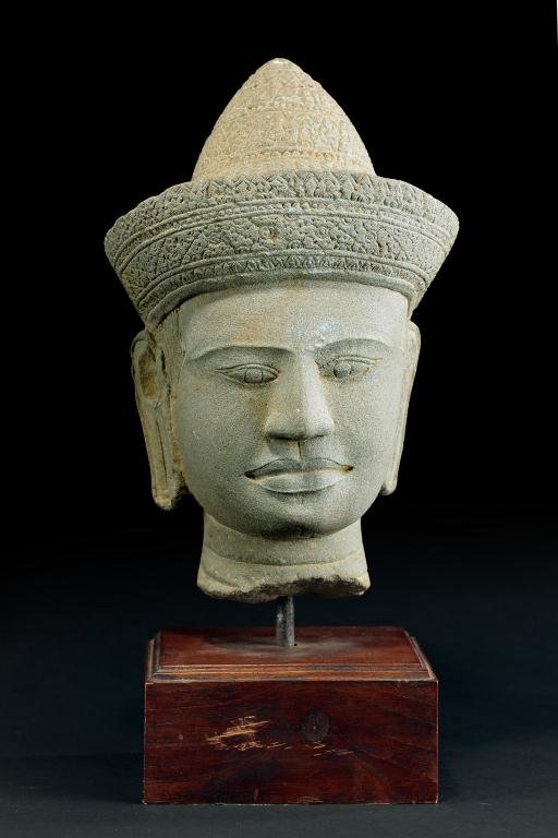 CAMBODIAN CARVED STONE HEAD: H: 11 1/8 in.(28cm)