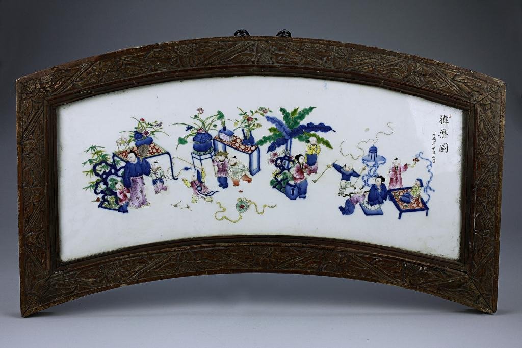 CHINESE DOUCAI HAND-PAINTED PORCELAIN PLAQUE: Of children and women in a playground signed by Wang Qi. L: 28 2/3 in. (72.5cm) x H 16 1/2 in. (42cm), in-frame