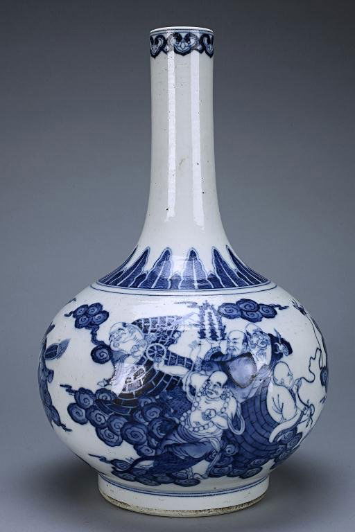 CHINESE BLUE AND WHITE BOTTLE NECK VASE: Of compressed globular form rising to a tall cylindrical neck, enameled to the body in cobalt blue tones, depicting figural scene amidst scrolling clouds and fire scrolls, all below a band of overlapp