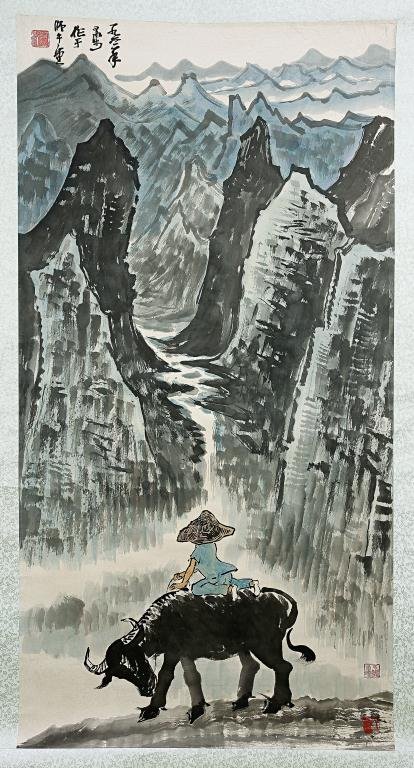 CHINESE SCROLL PAINTING OF A MAN RIDING A BUFFALO: Signature to read Li Keran. Li Keran (1907-1989) is a renowned contemporary Chinese painter. The year on the painting is 1961. L: 53 1/2 in.(133.5cm) x W: 26 1/2 in.(67cm)