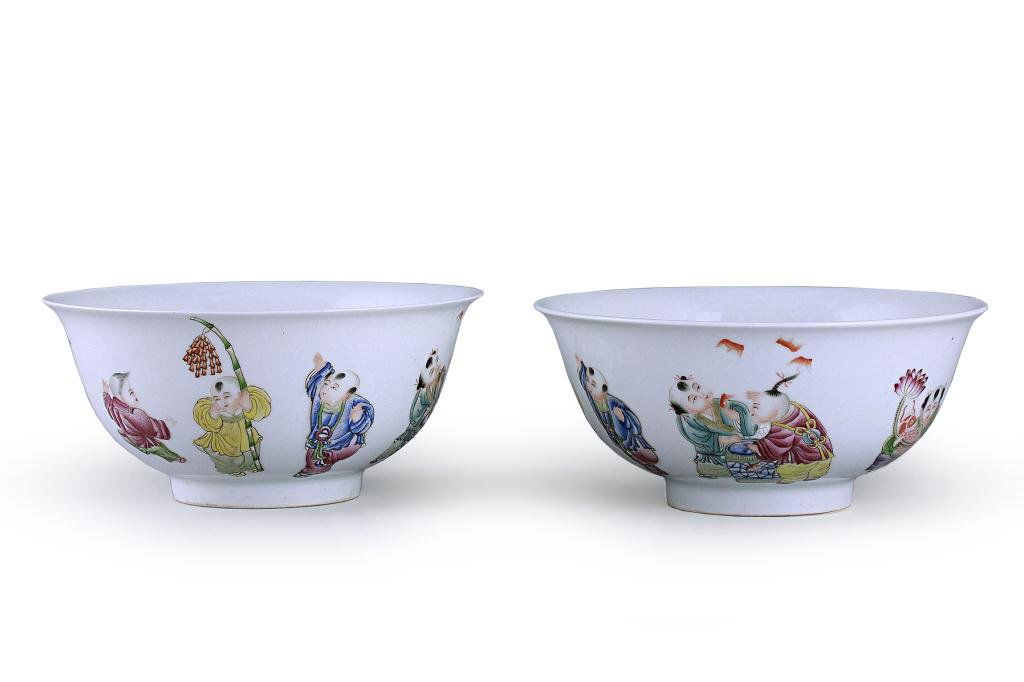 PAIR OF CHINESE '8 IMMORTAL' BOWLS: Each with steep rounded sides rising to a flaring rim, designed and hand painted with children at leisure; boys chatting, one boy holding a fish and a lotus flower, two boys with bats above their head