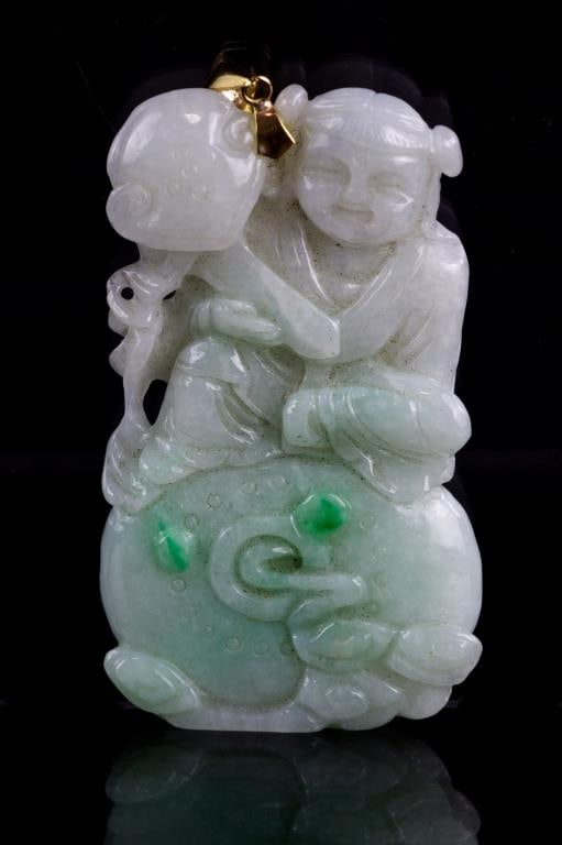 CHINESE JADEITE PENDANT WITH 14K GOLD: The translucent jadeite carved as a girl holding peach.