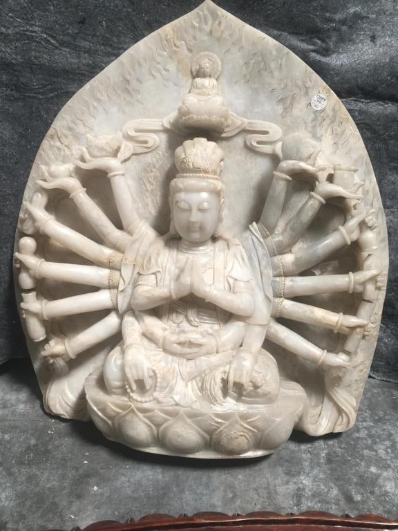 CARVED ALABASTER THOUSAND HAND GUANYIN: With wooden stand. H: 28 in.