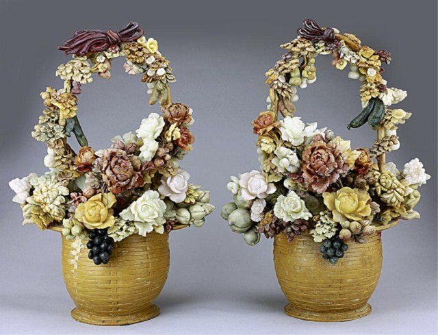 PAIR OF CHINESE CARVED SOAPSTONE FLOWER BASKETS: Finely carved dense flower and fruit baskets; of various blossoming flowers and buds, and of berries, gourds and peaches, on a rattan-like basket. H: 25 1/4 in.(64cm)
