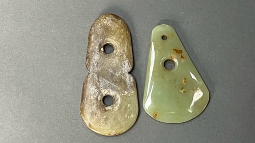 GROUP OF TWO CHINESE CARVED JADE PENDANTS