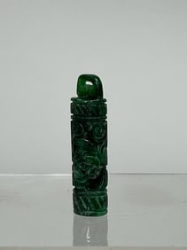 A CHINESE CARVED AMULET