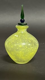 A BEAUTIFUL YELLOW PERFUME BOTTLE