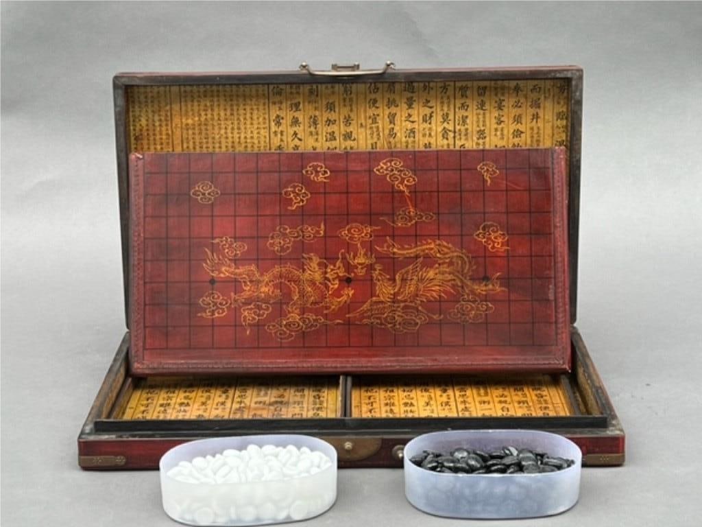 CHINESE LEATHER CHESS SET: An unusual Chinese chess set. The box opened up to the chess board. L: 20 1/2 in. W: 11 1/2 in.