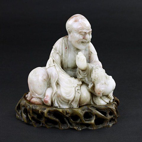 CHINESE CARVED SOAPSTONE OF A SCHOLAR: with a dragon on the side. H: 5 in.(12.5cm)