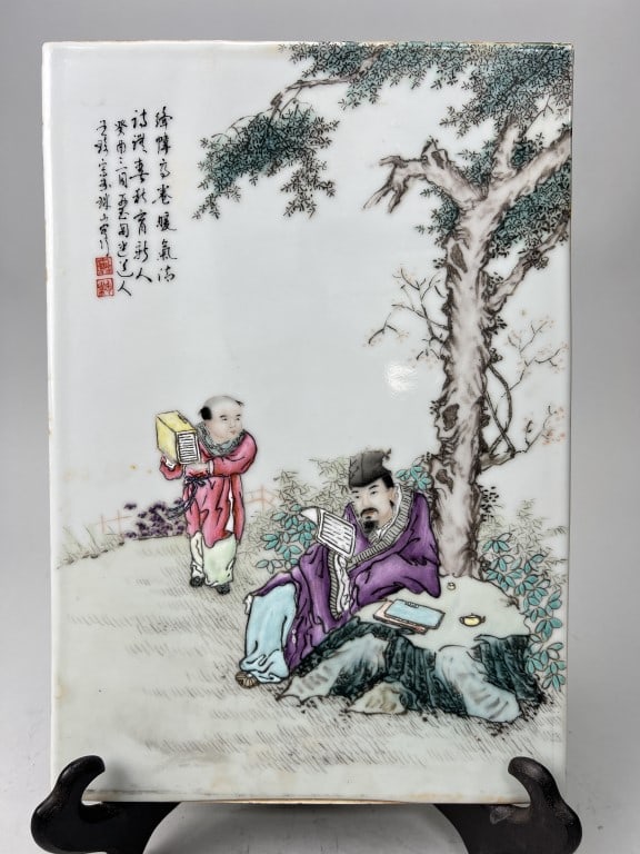 CHINESE PORCELAIN PLAQUE: Beautifully painted of a scholar and a book boy. Inscription to the top left.