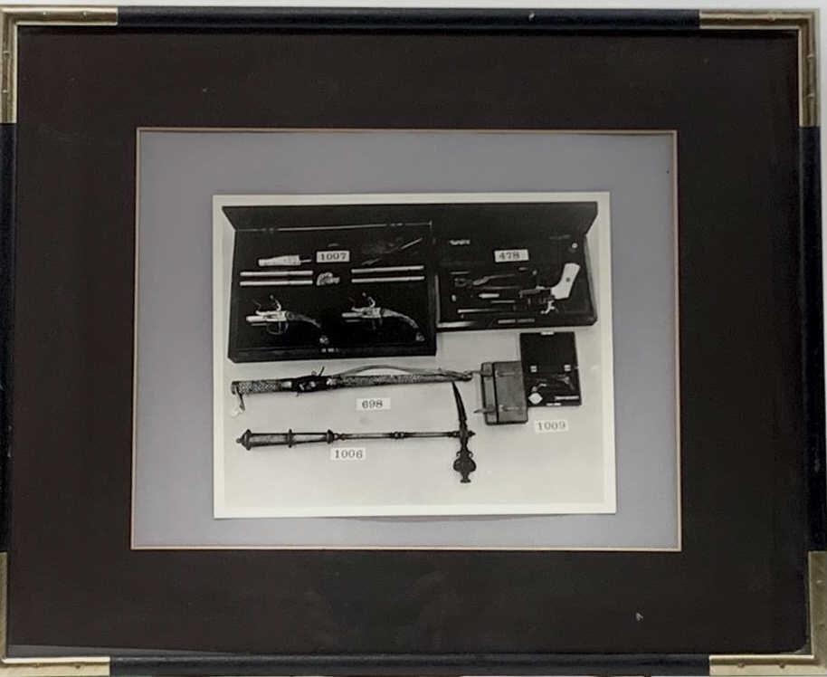 AFTER- ANDY WARHOL, AMERICAN (1928 - 1987): Framed, a photograph of gun collection. Gelatin Silver Print. Medium: Photograph Signature : Andy Warhol, and estate stamp on verso Frame: included Death emerged as a distinctive theme in Warhol’s w