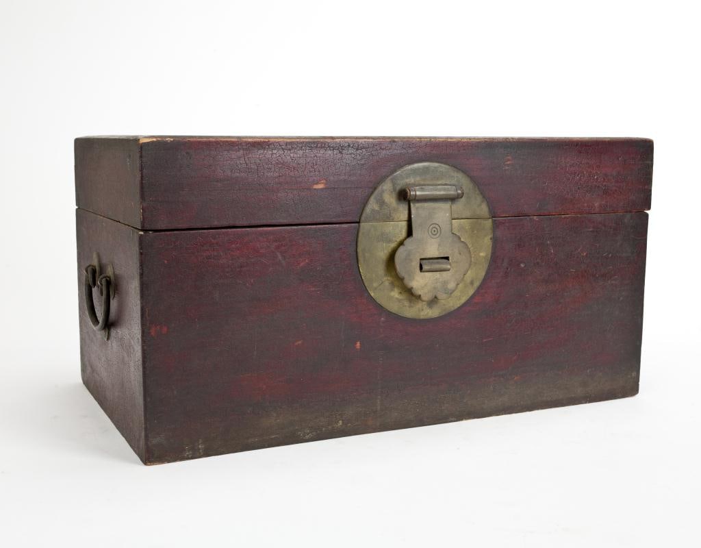 CHINESE CARVED WOOD BOX: Of rectangle shape, with two bronze handles on each side. L: 17 in. W: 9 3/4 in. H: 9 in.