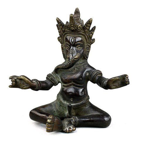 18TH CENTURY INDIAN BRONZE FIGURE OF GANESH: Finely modeled seated Ganesh with both hands raised in mudra, his elephant head with its long trunk unfurling towards his right shoulder, with the hair fashioned into a high chignon behind a five-peak