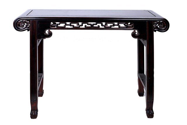 CHINESE CARVED WOOD ALTAR TABLE: Raised on square section paw-feet legs with a rectangular paneled top with scroll-over ends, the center carved with chain-like design above waves, in between carved floral motif to the sides. L: 46 in