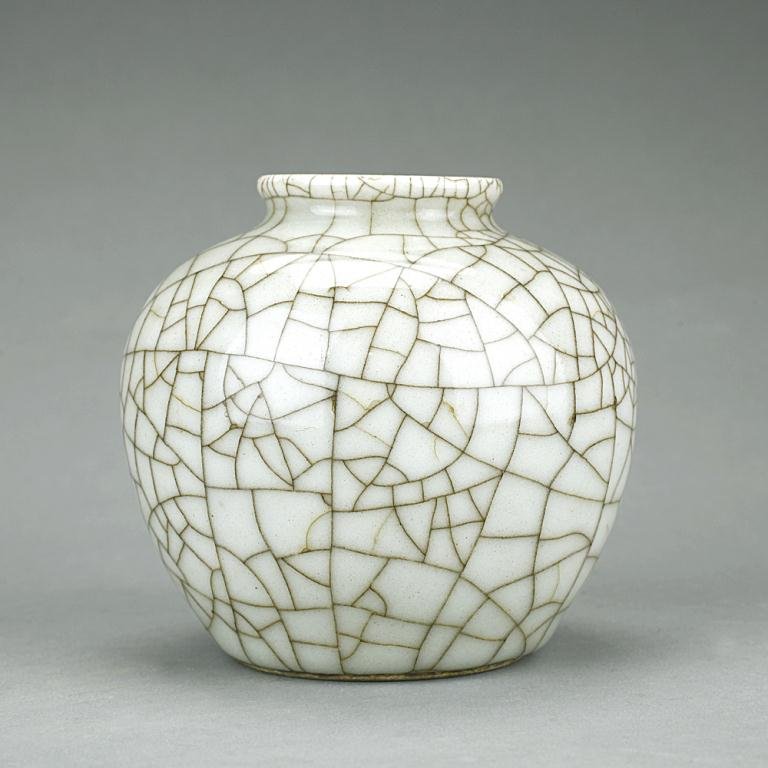 CHINESE CRACKLE WARE CELADON JAR: From the Private Collection of a Gentleman from Cambridge, England. Grey underglaze. From the Private Collection of a Gentleman from Cambridge, England. Of globular shape with short neck and slightly 